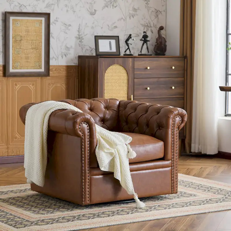 Fauteuil club pivotant capitonné Chesterfield